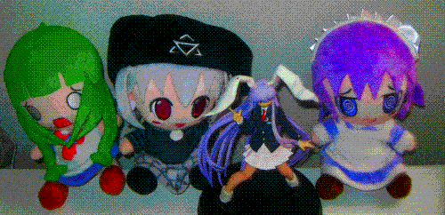 A picture of 3 plushies, ME-Tan, Digital Witch Mayura, Yakui the Maid, and a figure of Reisen Udongein Inaba from Touhou Project. 